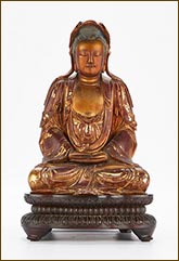 Carved Buddha for sale at Revere Auctions in St. Paul, MN, July 18, 2023, 020623